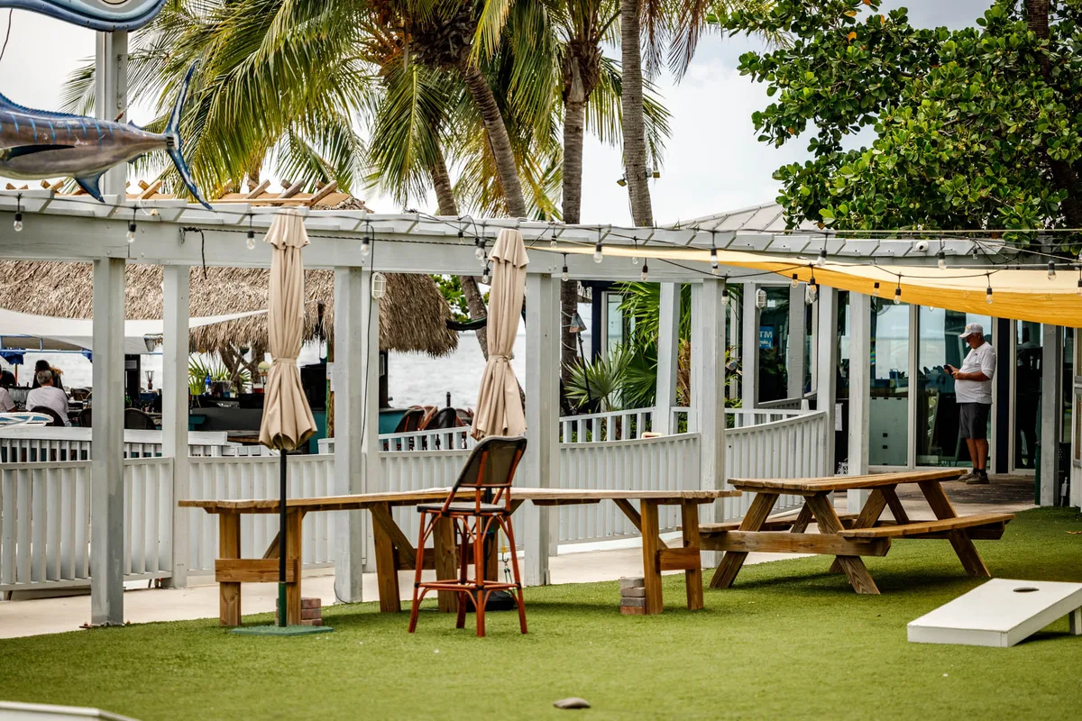 Outdoor tables beside the Sundowners waterfront dining area