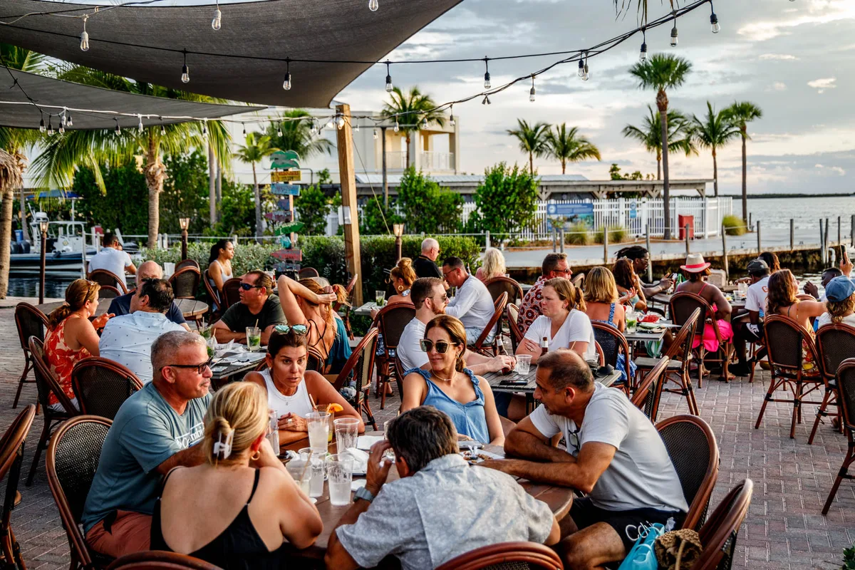 Guests dining together on the outdoor patio at Sundowners