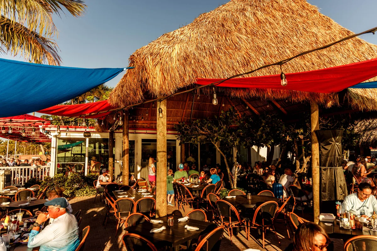 Outdoor waterfront seating at Sundowners