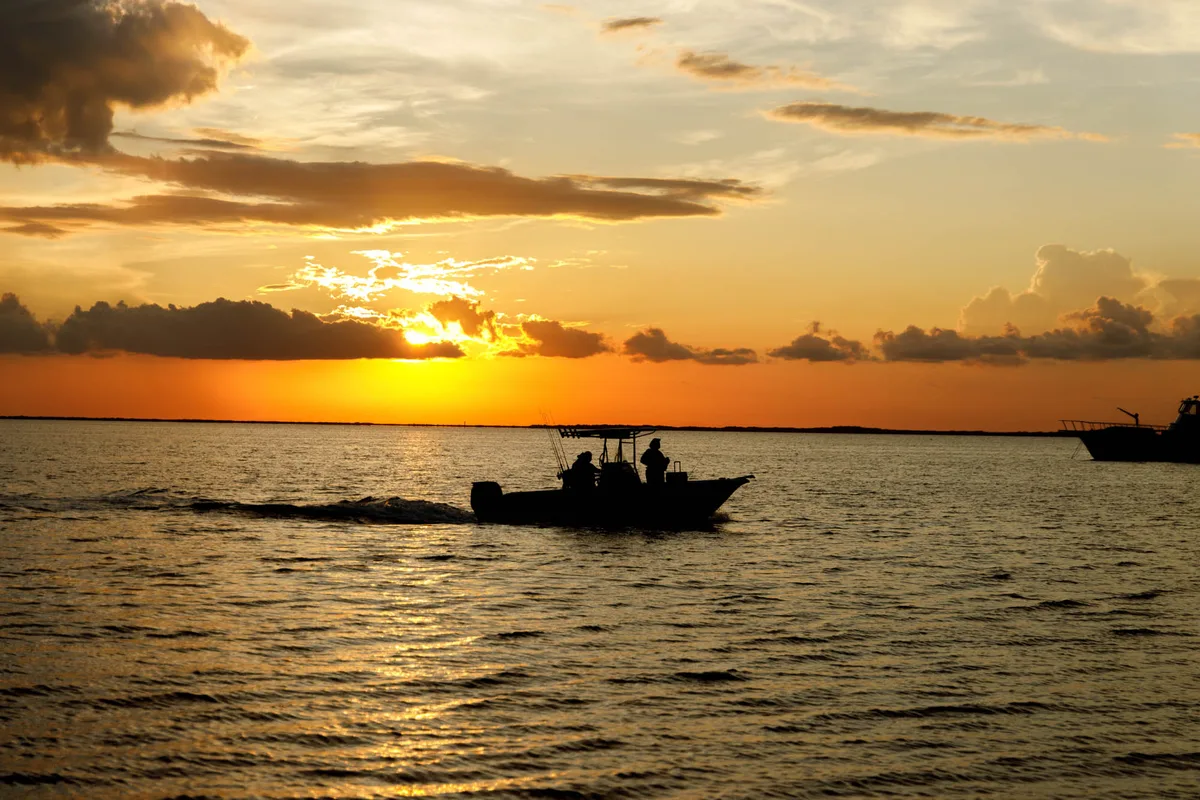 A boat on Florida Bay as the sun sets