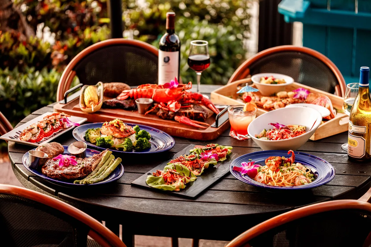 Seafood and other dishes arranged on a Sundowners patio table