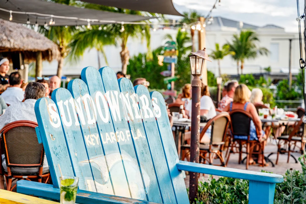 Sundowners waterfront patio and signature blue chair