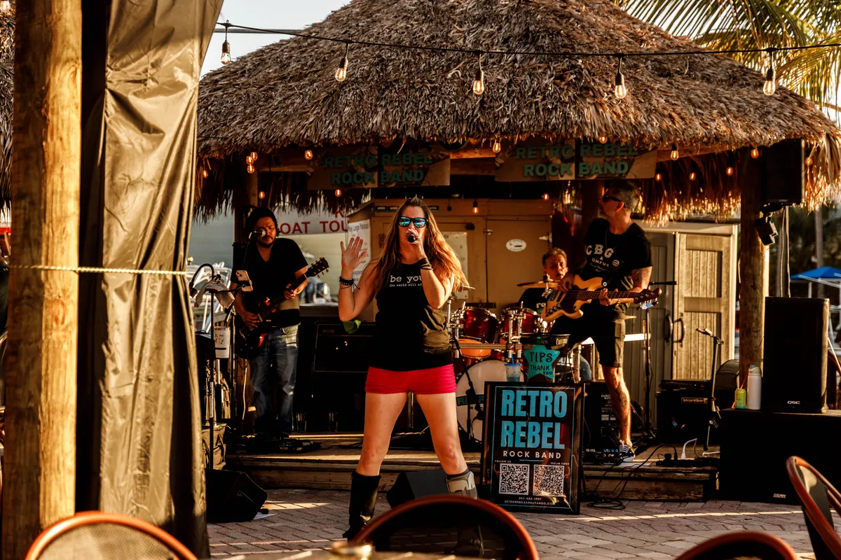 Live band performing outdoors at Sundowners
