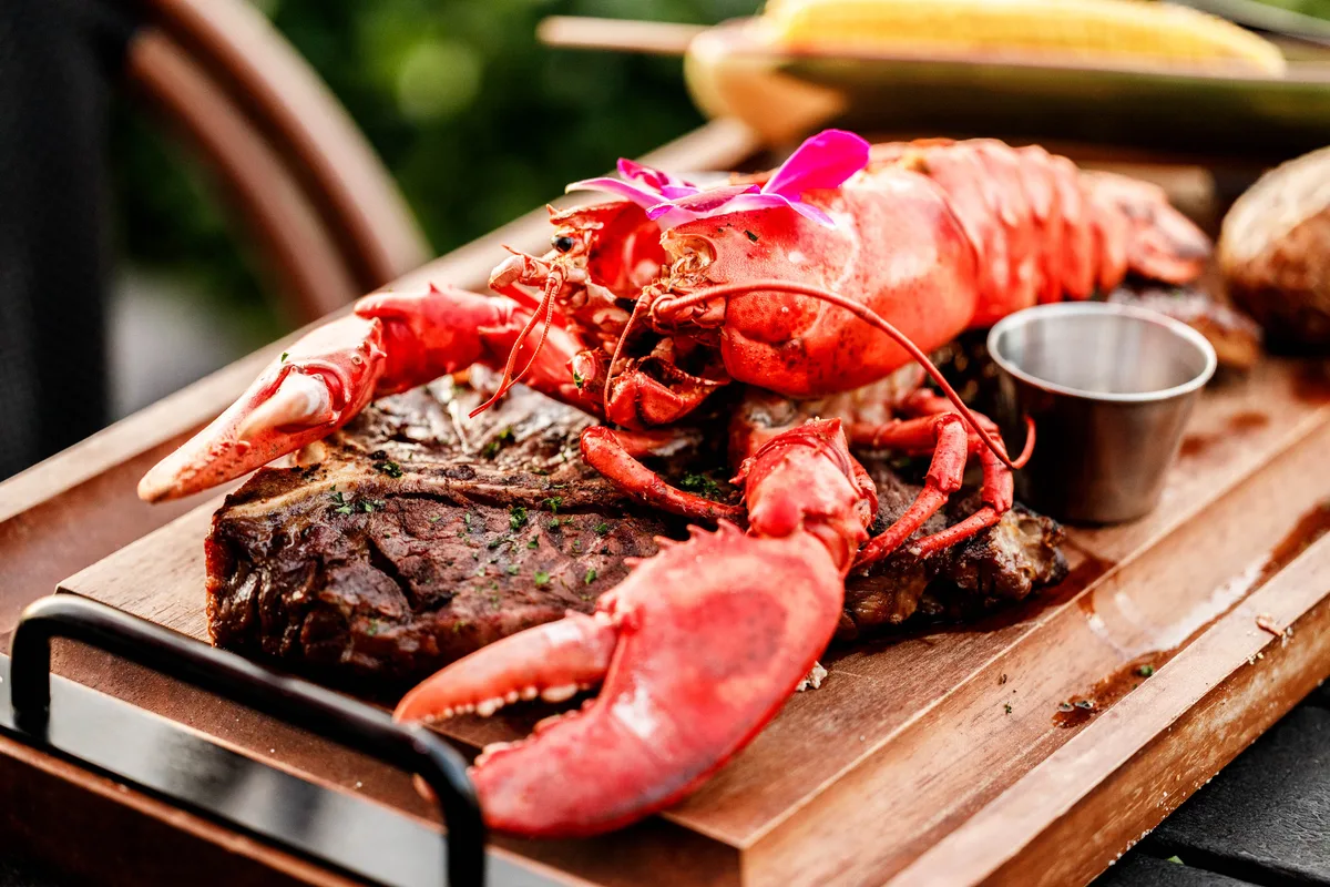 Sundowners' Feast with whole lobster and USDA Prime Porterhouse steak